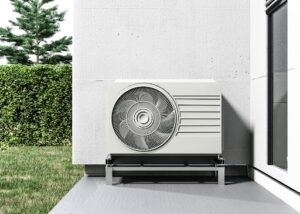 stock image of heat pump outside a home